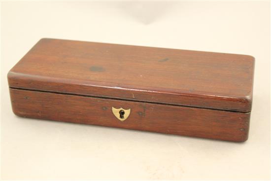 A mahogany cased set of indoor carpet bowls, 9.75in.